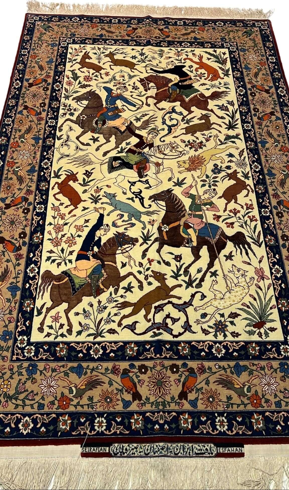 Full view of a hand-knotted Seirafian hunting scene rug, crafted by Master Ahmad Seirafian with silk and wool.